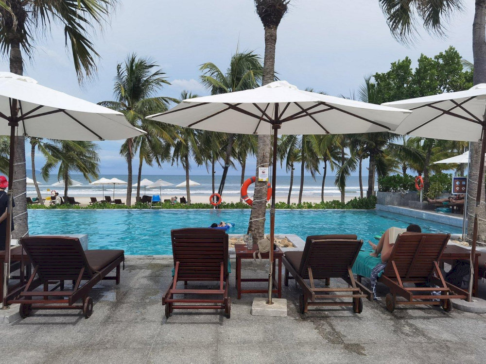 Escape to paradise where the pool meets the sea, and every hour feels like golden hour